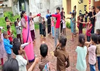 Young children practicing yoga and basic fitness exercises at an Anganwadi centre in Ujjain, India