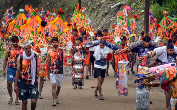 Pilgrims participating in the Kanwar Yatra under stringent security