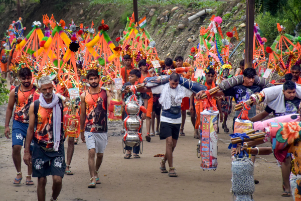 Pilgrims participating in the Kanwar Yatra under stringent security