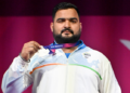 Indian Weightlifter Lovepreet Singh receiving his silver medal