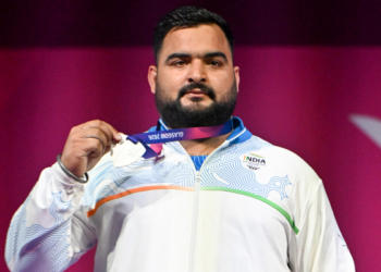 Indian Weightlifter Lovepreet Singh receiving his silver medal