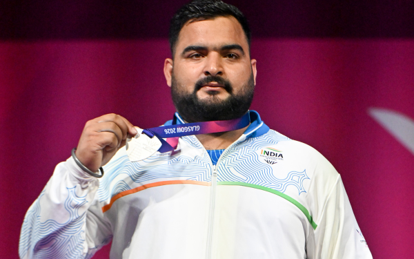 Indian Weightlifter Lovepreet Singh receiving his silver medal