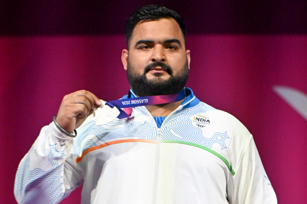 Indian Weightlifter Lovepreet Singh receiving his silver medal