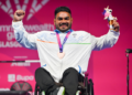 Jhandu Kumar receiving the bronze medal at the Commonwealth Games